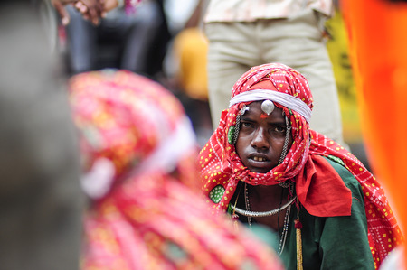 Udaipur, India, september 14, 2010:  A portrait of young boy singing with his group on the street in India.のeditorial素材