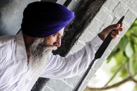 Amritsar, India, september 5, 2010: Portrait of Indian man guard, with blue turban.のeditorial素材