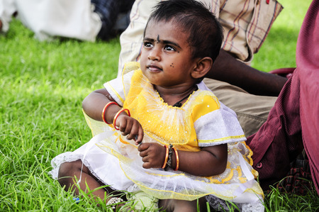 Agra, India, september 15, 2010: Little indian child with paintings on a face.のeditorial素材