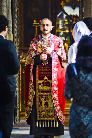 Tbilisi, Georgia, November 16, 2014: Georgian orthodox priest during wedding ceremony in church in Georgia.のeditorial素材