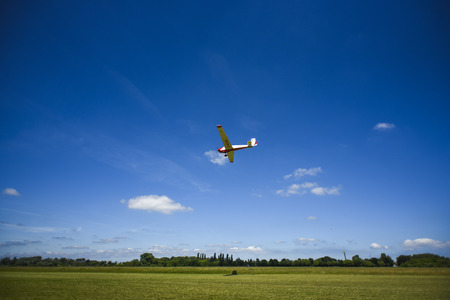 Small plane flying on the blue sky. Polandの写真素材
