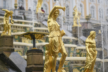 Peterhof, Russia, October 5, 2016: Golden sculpture in the park in Peterhof Palace in Russia.のeditorial素材