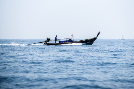 Long tail boat sailing on Andaman sea, Krabi Thailand.の写真素材
