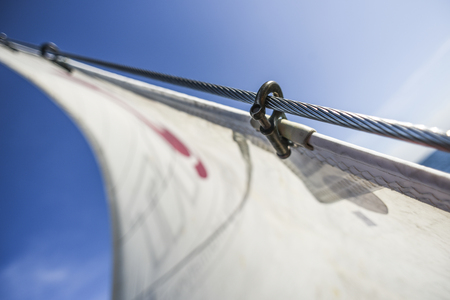 Sails on a sailboat at sea in the north of summer.の写真素材