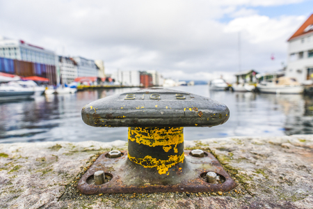 Old  harbor mooring in the background of the summer marina on a sunny day.