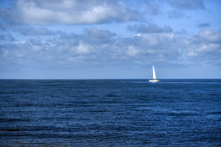 Landscape, sailboat on the North Sea, on a sunny day with beautiful clouds.の写真素材