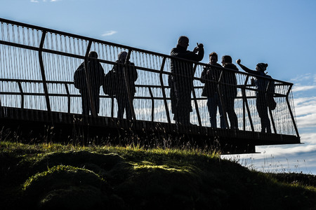 Tourists visiting and photographing an Icelandic canyon.のeditorial素材