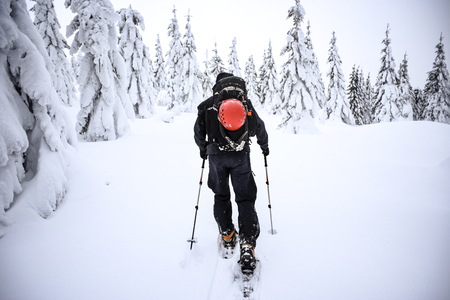 Men trekking in the mountains. Winter mountain landscape.