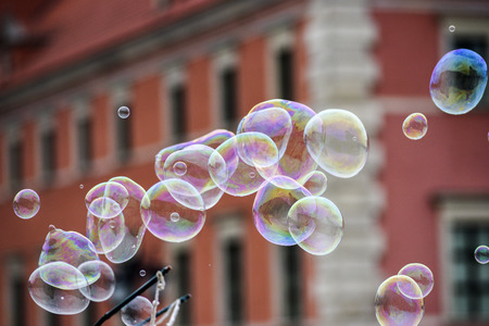 Soap bubbles on the background of architecture.