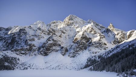 Panorama of the Tatra Mountains on Morskie Oko in winter.の写真素材