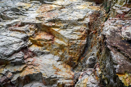 Colorful rock rock texture, geological phenomenon in the rocks above the atlantic ocean.