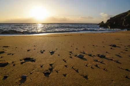 Sandy and rocky coast of the Atlantic Ocean in France. Rocks and beach beautiful landscape at sunset.の写真素材