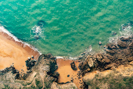 Beautiful landscape in retro, vintage colors. Sea landscape, drone view of the rocky coast above the ocean.の写真素材