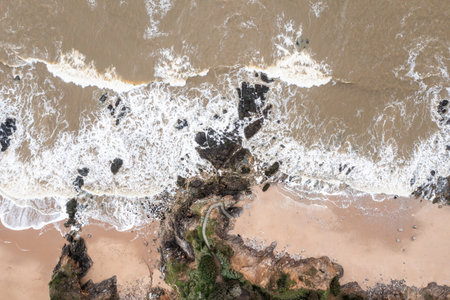 Rocky ocean coast in France, view from a drone.