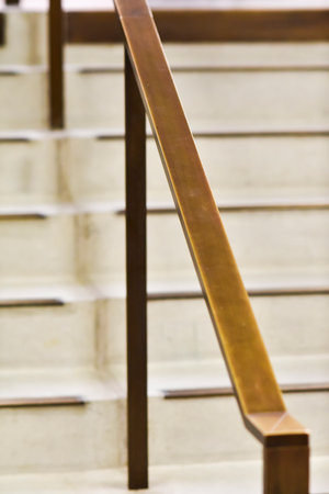 A metal handrail inside the building to hold while going down.の写真素材