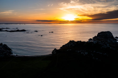 Drone view of Primel Tregastel, ocean coast in France, Brittany at sunset.の写真素材