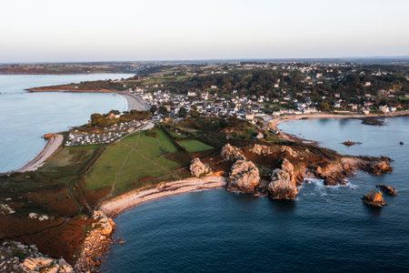 Drone view of Primel Tregastel, ocean coast in France, Brittany at sunset.の写真素材