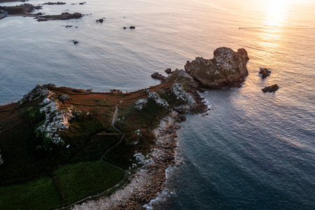 Drone view of Primel Tregastel, ocean coast in France, Brittany at sunset.の写真素材