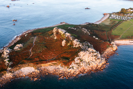 Drone view of Primel Tregastel, ocean coast in France, Brittany at sunset.の写真素材