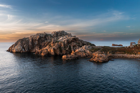 Drone view of Primel Tregastel, ocean coast in France, Brittany at sunset.の写真素材