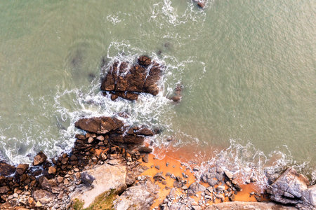 Beautiful ocean landscape from a drone. View of the ocean, rocks and sand.