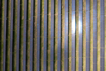 Photovoltaic farm. Photovoltaic panels in a field, view from a drone.
