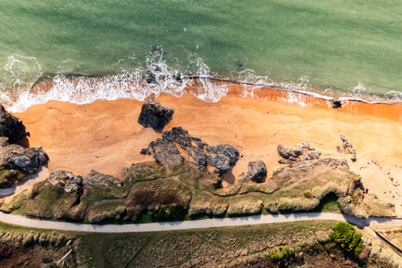 A beautiful coastal landscape. Rocks, ocean, and beach off the coast of Brittany, France.の写真素材