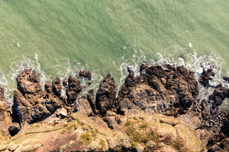 A beautiful coastal landscape. Rocks, ocean, and beach off the coast of Brittany, France.の写真素材