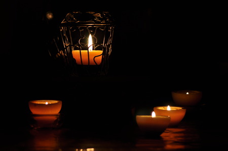 Lamp, candle shining in the darkness. Challis flame. Artistic composition. Lighting.の写真素材