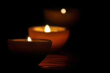 Lamp, candle shining in the darkness. Challis flame. Artistic composition. Lighting.の写真素材