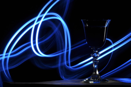 Champagne on New Year's Eve. Fajerwerek flares. New Year's greetings. Happiness and fun.の写真素材