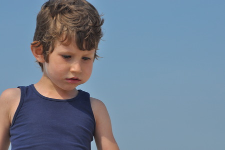 Portrait of a little boy. A child with curly hairの写真素材