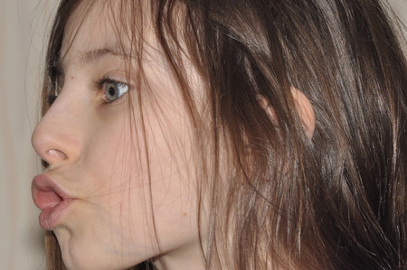 Portrait of a teenager. Brunette with long hair.の写真素材