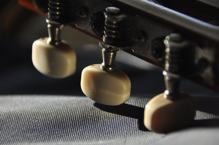 Classical guitar. Issuing a stringed instrument sounds. Fretboard, strings and resonationの写真素材