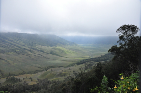 Climbing the volcano Bromo, Indonesia. Clouds obscured the crater and green valleyの写真素材