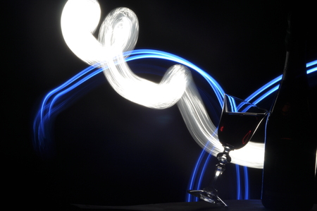 Champagne on New Year's Eve. Fajerwerek flares. New Year's greetings. Happiness and fun.の写真素材