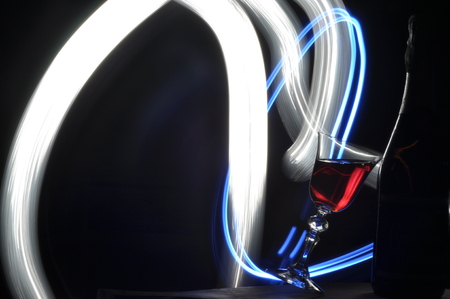 Champagne on New Year's Eve. Fajerwerek flares. New Year's greetings. Happiness and fun.の写真素材