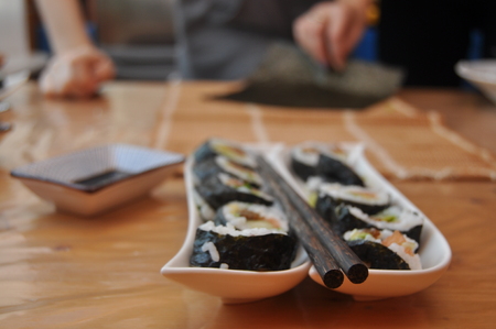 Sushi. Delicious meal with fish, rice and supplements, prepared at home.の写真素材