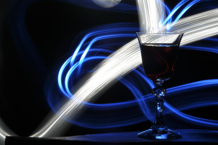 Champagne on New Year's Eve. Fajerwerek flares. New Year's greetings. Happiness and fun.の写真素材