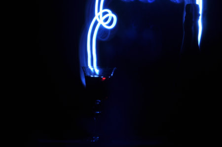 Champagne on New Year's Eve. Firework flares. New Year's greetings. Happiness and fun.