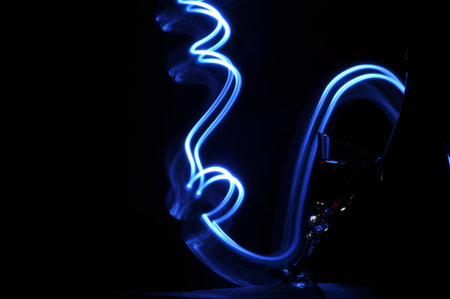 Champagne on New Year's Eve. Firework flares. New Year's greetings. Happiness and fun.の写真素材