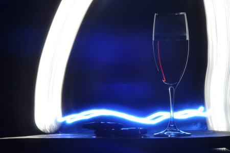 Champagne on New Year's Eve. Firework flares. New Year's greetings. Happiness and fun.の写真素材