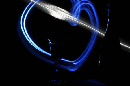 Champagne on New Year's Eve. Firework flares. New Year's greetings. Happiness and fun.の写真素材