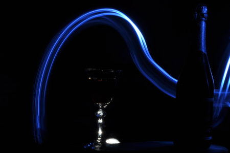 Champagne on New Year's Eve. Firework flares. New Year's greetings. Happiness and fun.