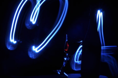 Champagne on New Year's Eve. Firework flares. New Year's greetings. Happiness and fun.の写真素材