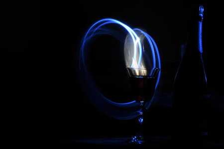 Champagne on New Year's Eve. Firework flares. New Year's greetings. Happiness and fun.