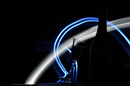 Champagne on New Year's Eve. Firework flares. New Year's greetings. Happiness and fun.の写真素材