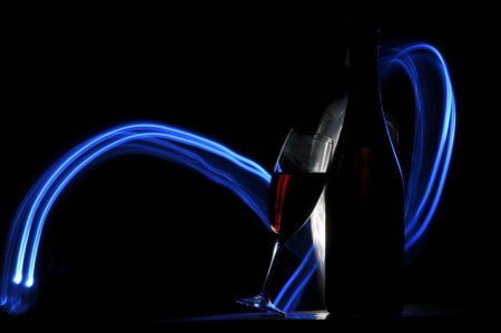 Champagne on New Year's Eve. Firework flares. New Year's greetings. Happiness and fun.の写真素材