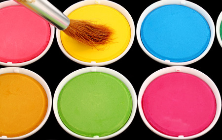 paints of different colors and slim paintbrush (brush)の写真素材