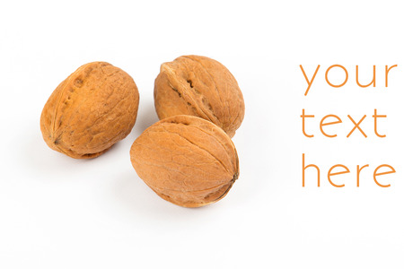 closed walnuts closeup on white background